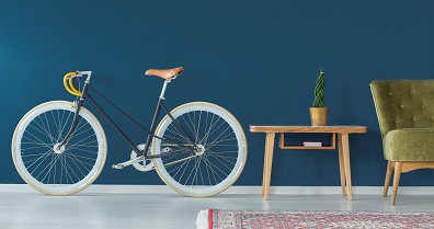 Stylish bike and vintage furniture in modern interior